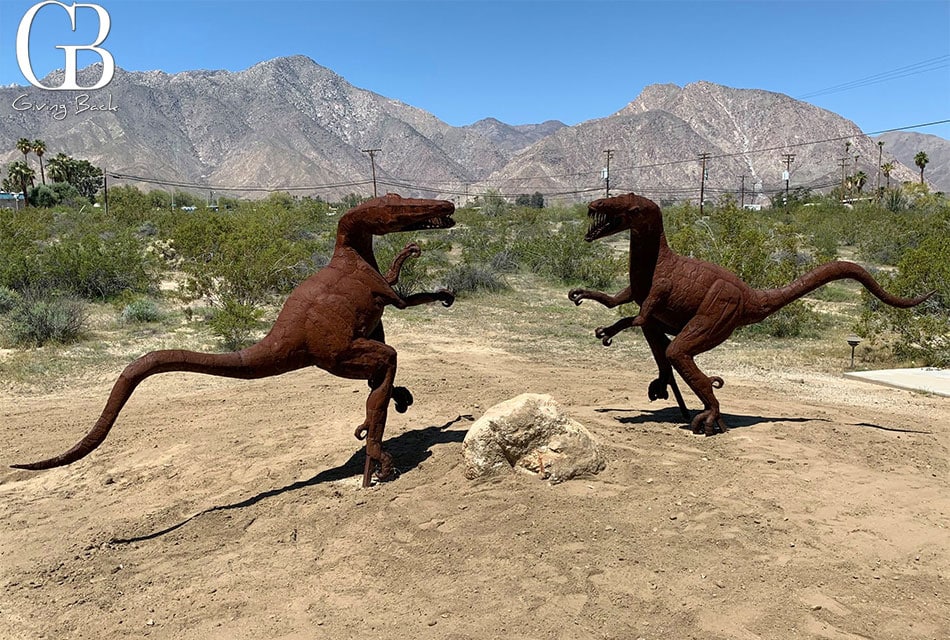 two dinosaur  statue stand and see each at Borrego Springs