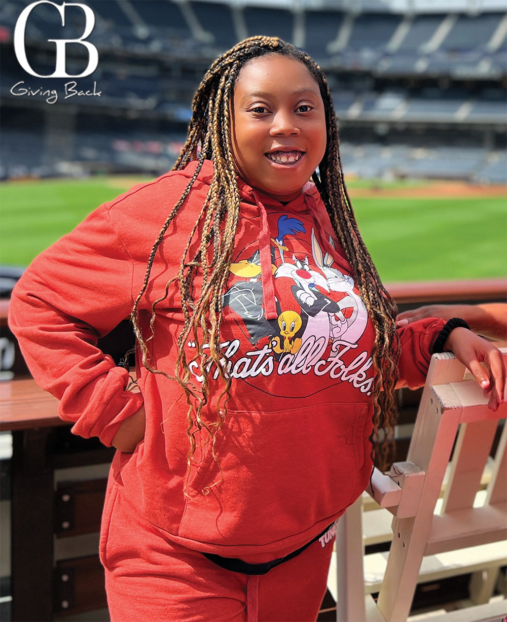 Smiling face of Selina standing in the stadium