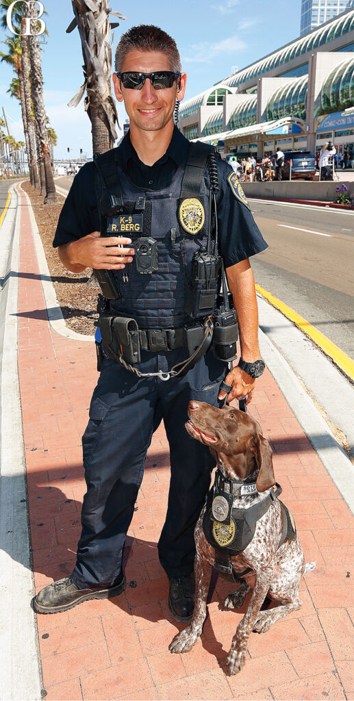 San Diego Police Officer with K9 standing at road